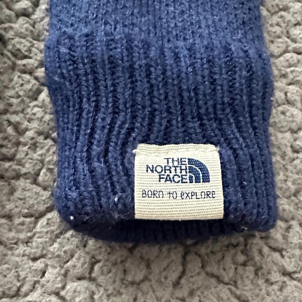 The North Face Kids Navy Blue Mittens with Gold Camera Graphic